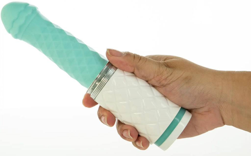 Pillow talk feisty teal silicone vibrator in teal and white with a textured surface and metallic silver accent ring