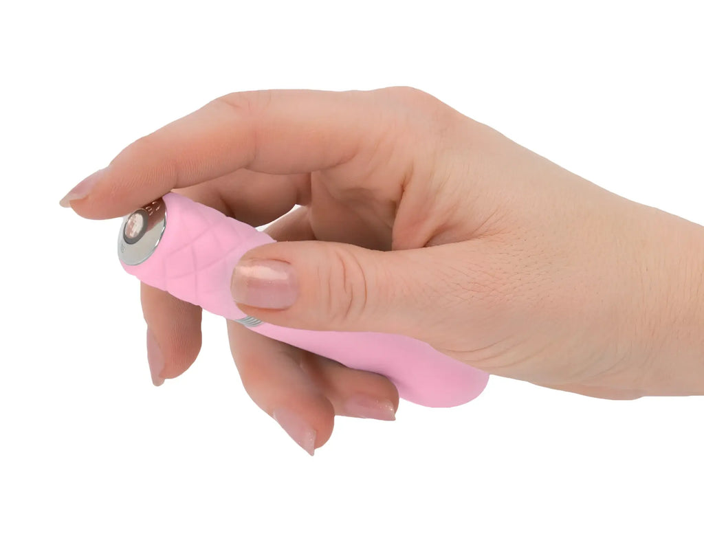 Pink silicone handheld personal massager with silver metallic button textured grip pillow talk flirty pink