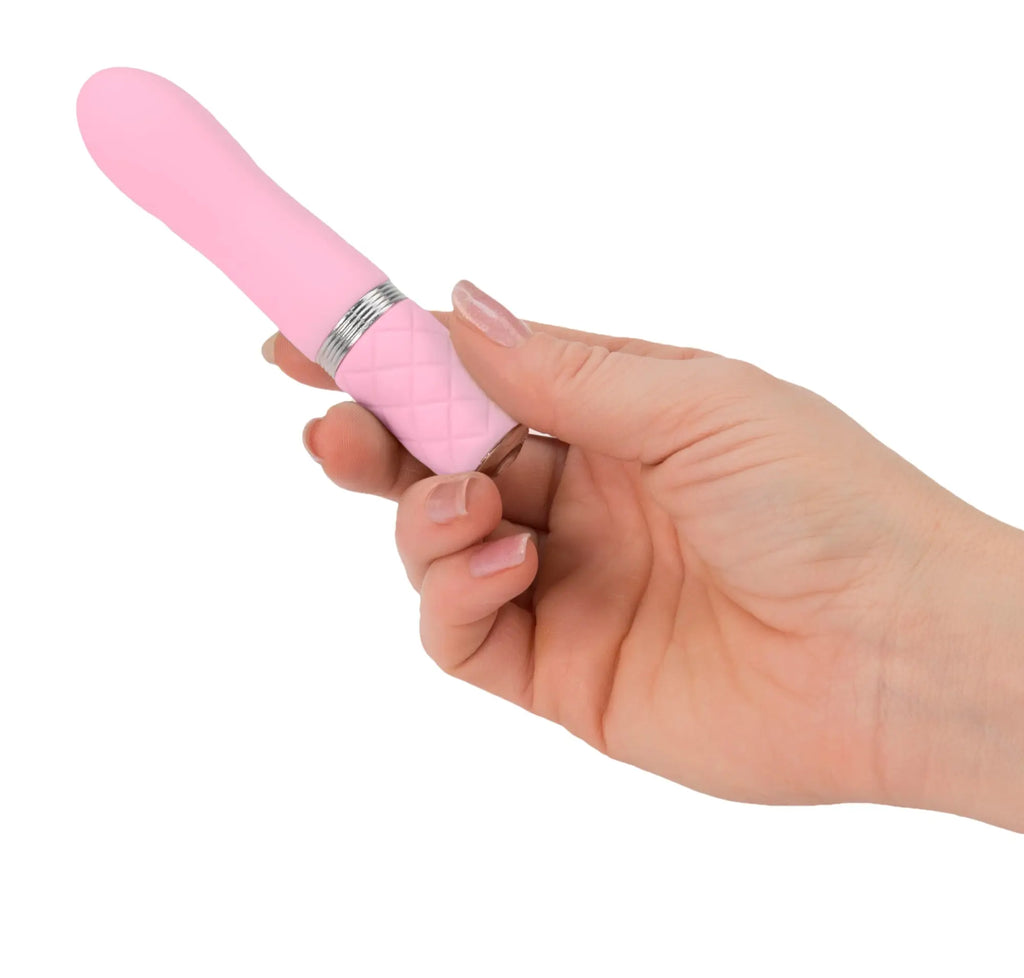 Pink silicone vibrator pillow talk flirty pink with quilted texture and silver metallic band for intimate use