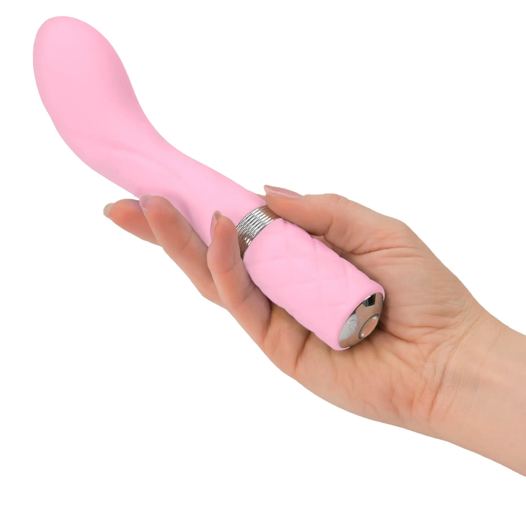 Pink silicone vibratory wand pillow talk sassy pink with silver textured band and metallic button at the base