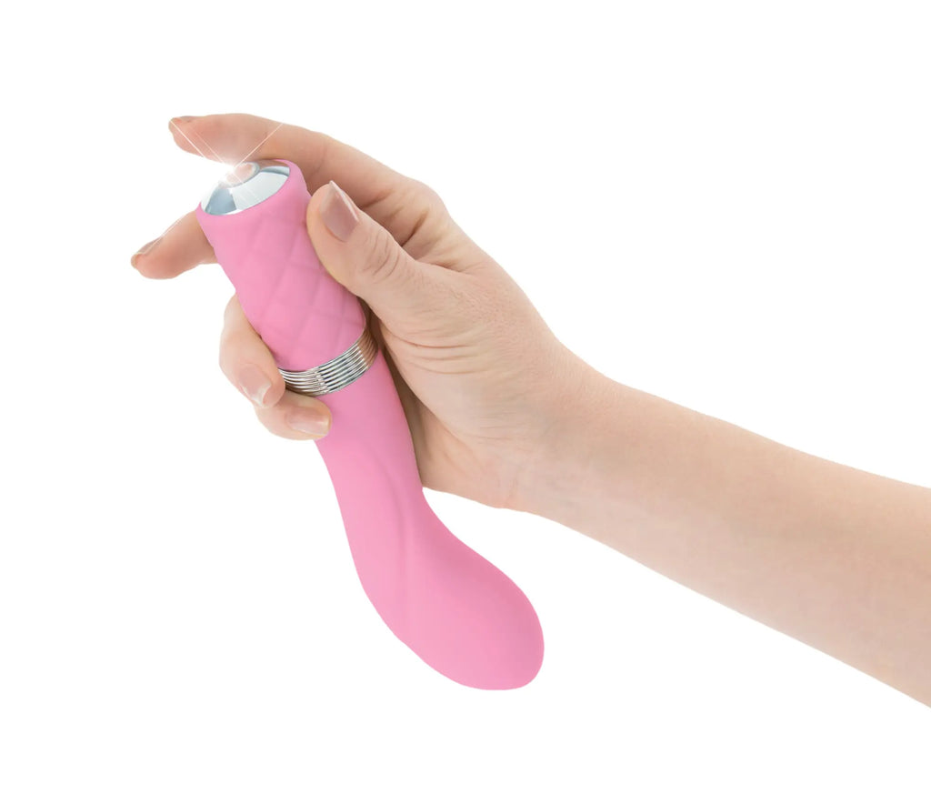 Pink silicone vibratory wand pillow talk sassy pink with silver band and clear dome tip for personal use