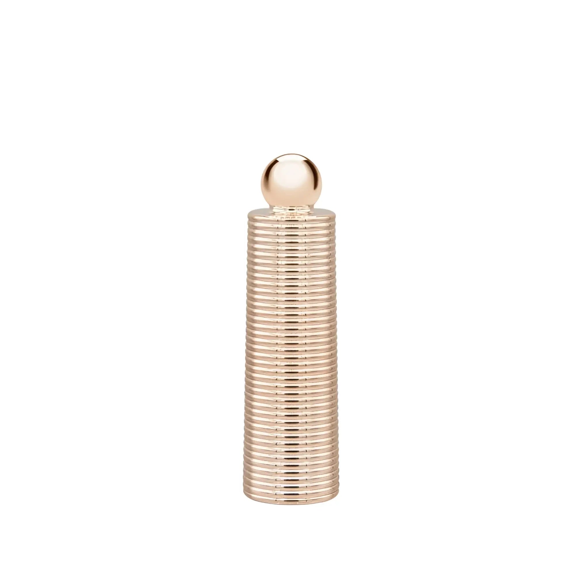 A sleek rose gold metallic ribbed cylindrical bottle with a polished spherical cap from pillow talk secrets desires massager set