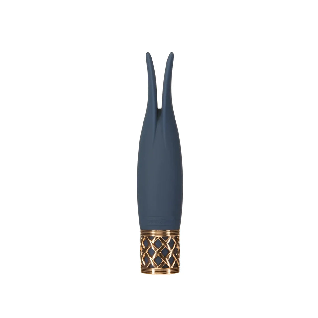 A sleek navy blue silicone playful massager with a gold-toned lattice patterned base from Pillow Talk Secrets