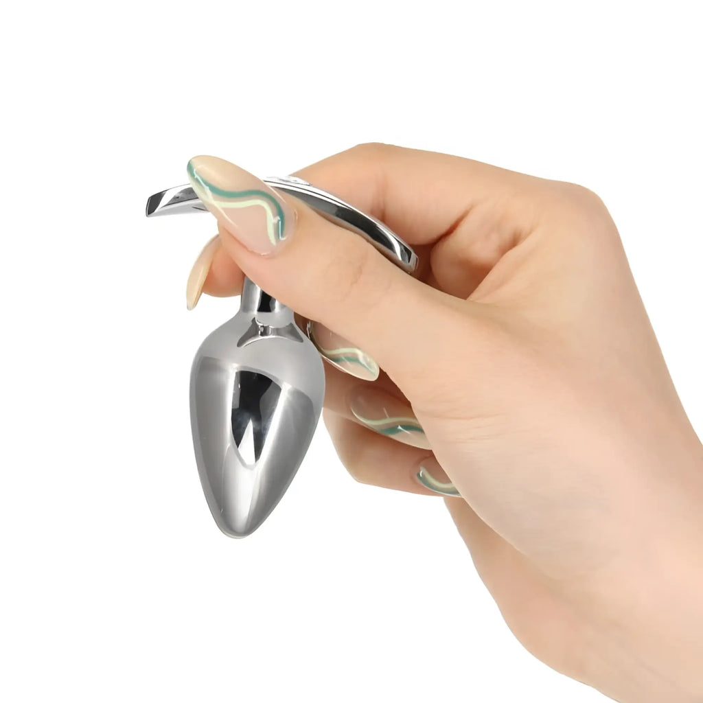 Silver metallic pillow talk sneaky luxurious stainless steel anal plug with teardrop shape and curved handle for grip