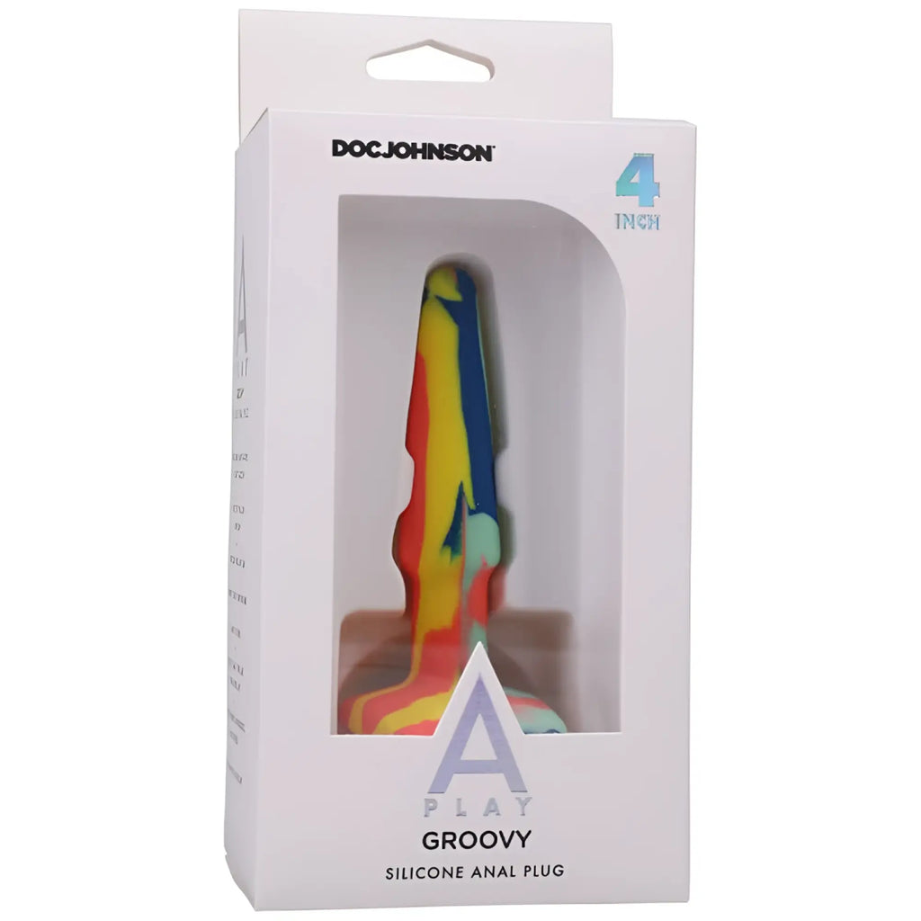 A colorful 4-inch silicone anal plug with a vibrant rainbow swirl pattern and doc johnson packaging