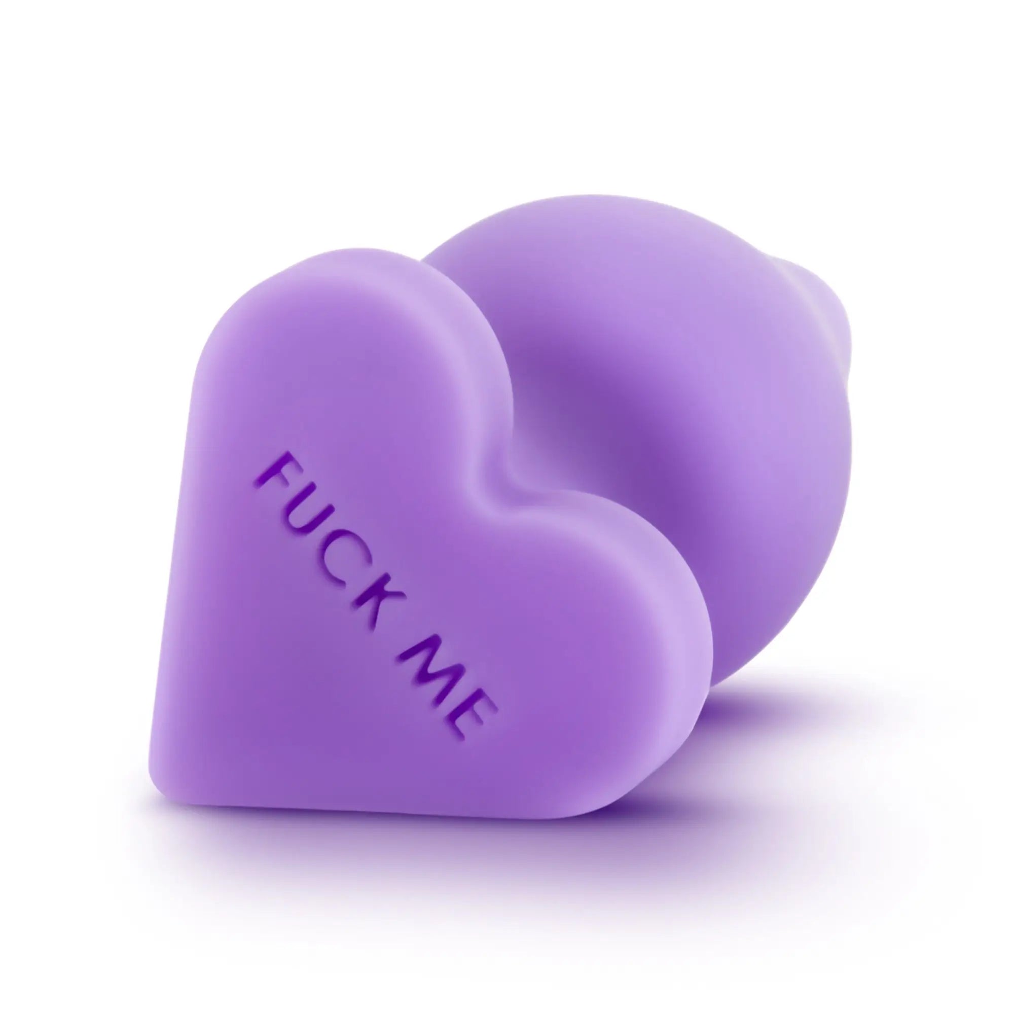 Purple heart-shaped silicone butt plug engraved with fuck me from Play With Me Naughtier Candy Heart collection