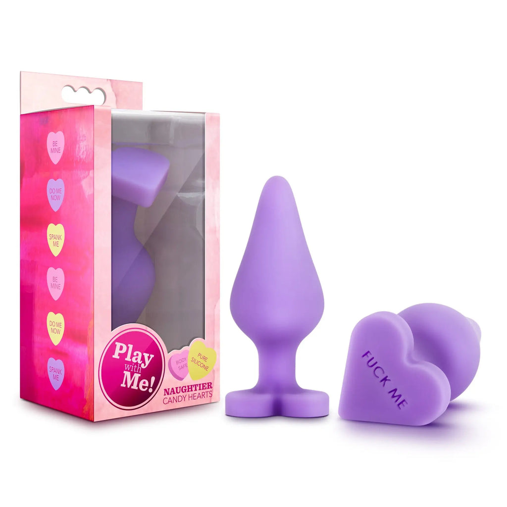 Purple silicone anal plug with heart-shaped fuck me cap in a pink candy-themed box play with me naughtier candy heart