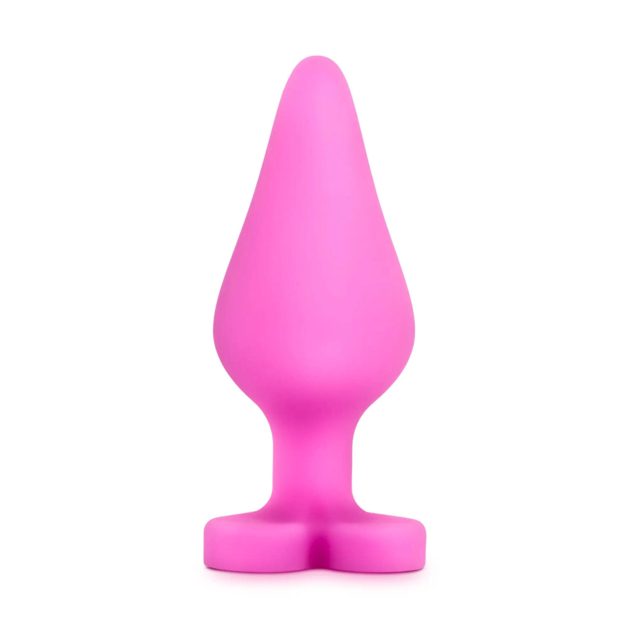 A vibrant pink silicone butt plug with tapered head and wide base from play with me naughty candy heart be mine