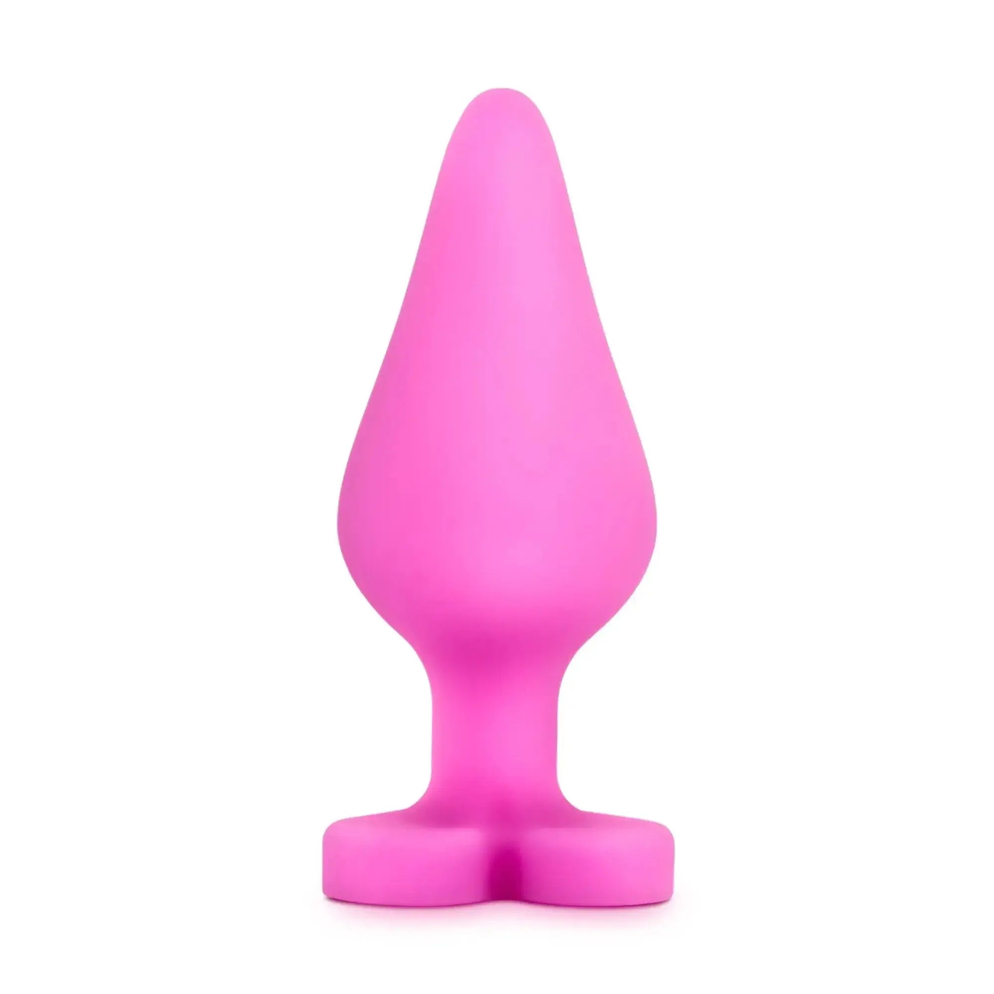 A vibrant pink silicone butt plug with tapered head and wide base from play with me naughty candy heart be mine