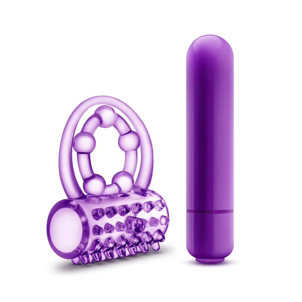 Purple silicone vibrating double strap cock ring with textured roller head and sleek cylindrical vibrator for play