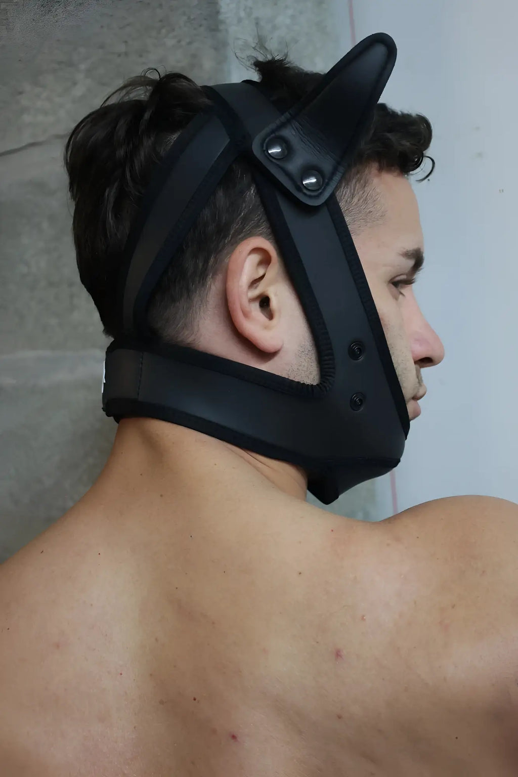 Black leather poundtown pup mask 2.0 in blue with adjustable straps and metal rivets shown from the back side