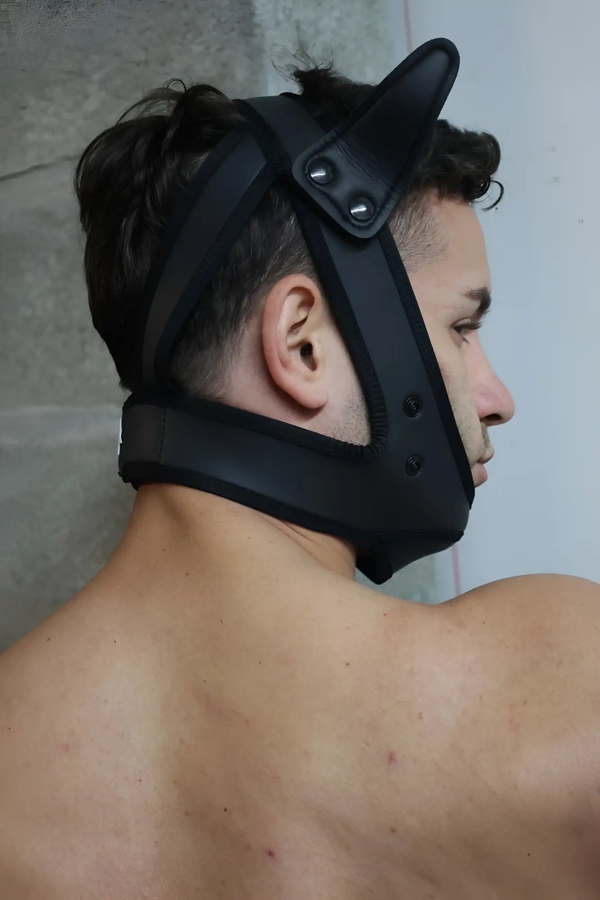 Black leather poundtown pup mask 2.0 in blue with adjustable straps and metal rivets shown from the back side