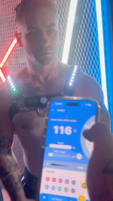 A sleek black prismaglow bulldog harness worn on the wrist with a glowing digital smartwatch display and illuminated buttons