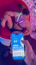 A vibrant pink and purple prismaglow cross harness digital display on a smartphone showing the time 6 2