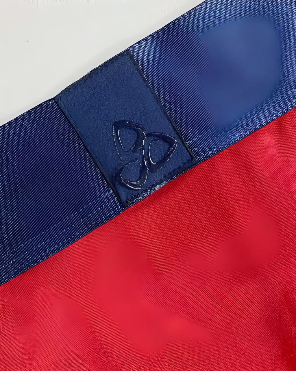 Red falcon private structure athlete mini briefs with blue elastic waistband and stitched logo patch