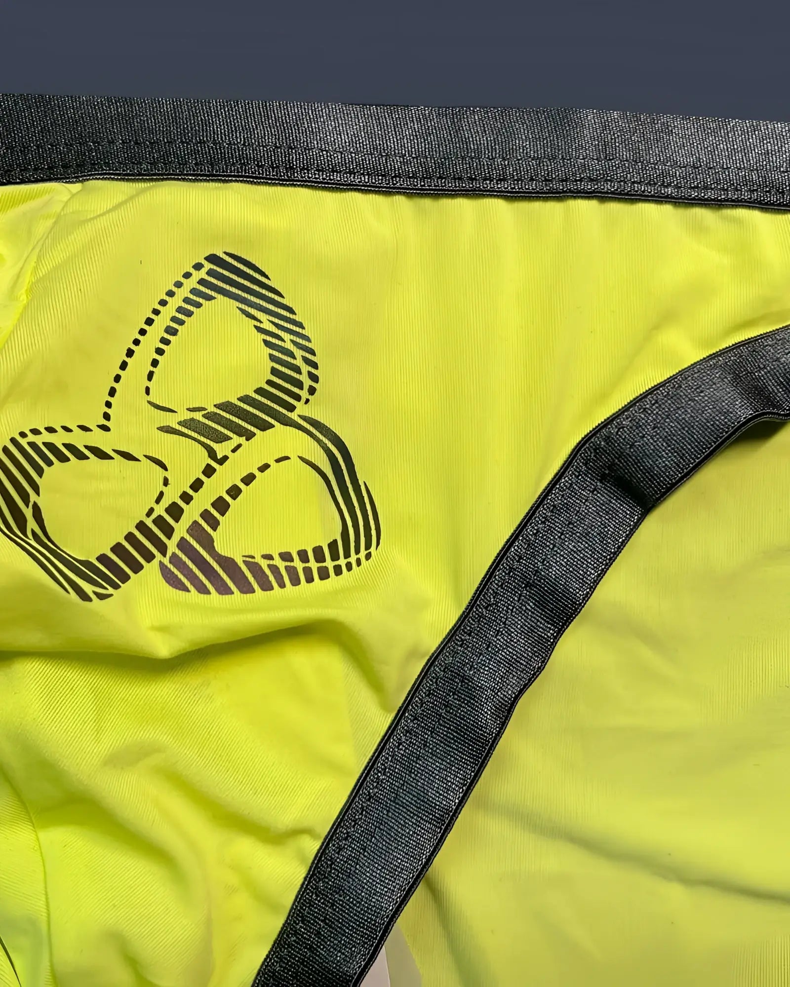 Bright yellow private structure brut4393 bare bikini briefs with dark gray waistband and black three-leaf logo