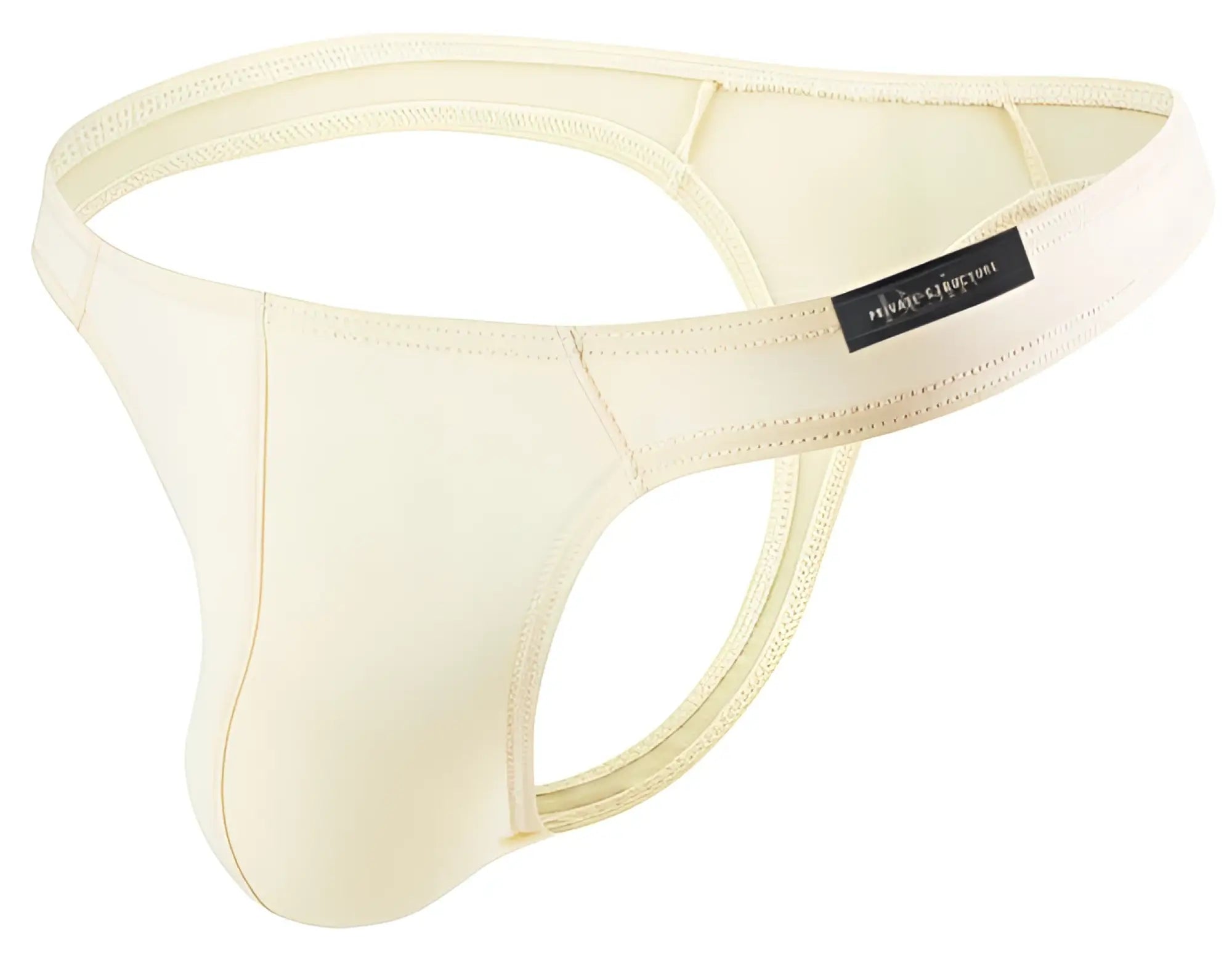 Cream-colored smooth men’s thong with black private structure brand tag on waistband from desire glaze nude collection