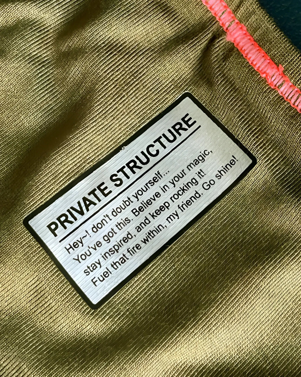 Olive green textured fabric private structure label on the back of a prime eutopia bikini brief epus4563