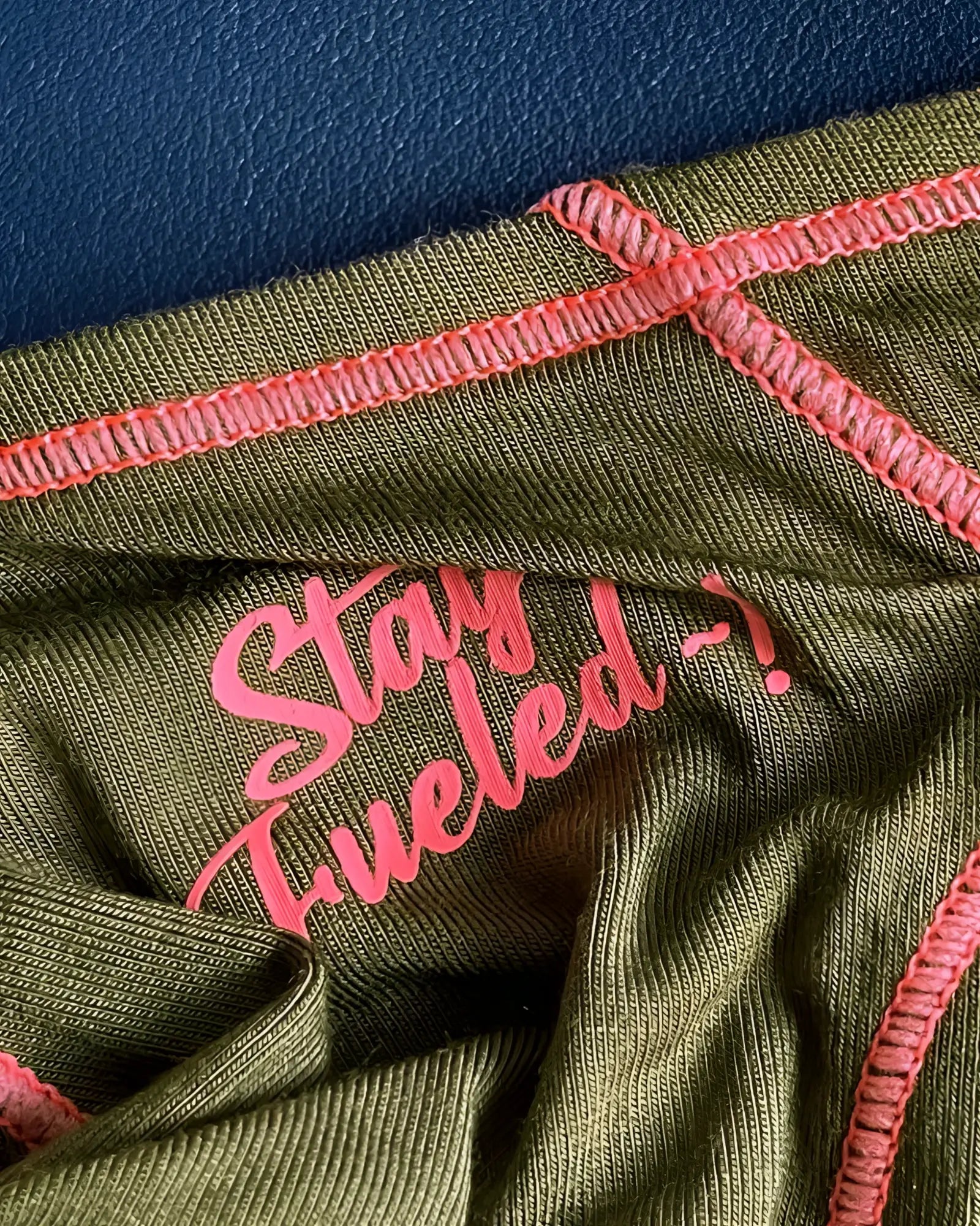Olive green ribbed fabric private structure prime eutopia bikini brief with pink embroidered text and matching stitching