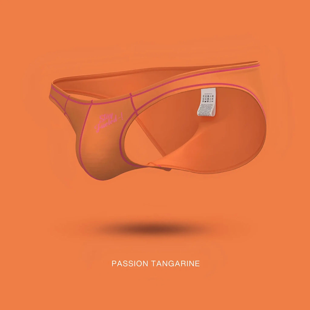 Orange private structure prime eutopia bikini brief with pink trim and white tag on inner waistband in tangarine color