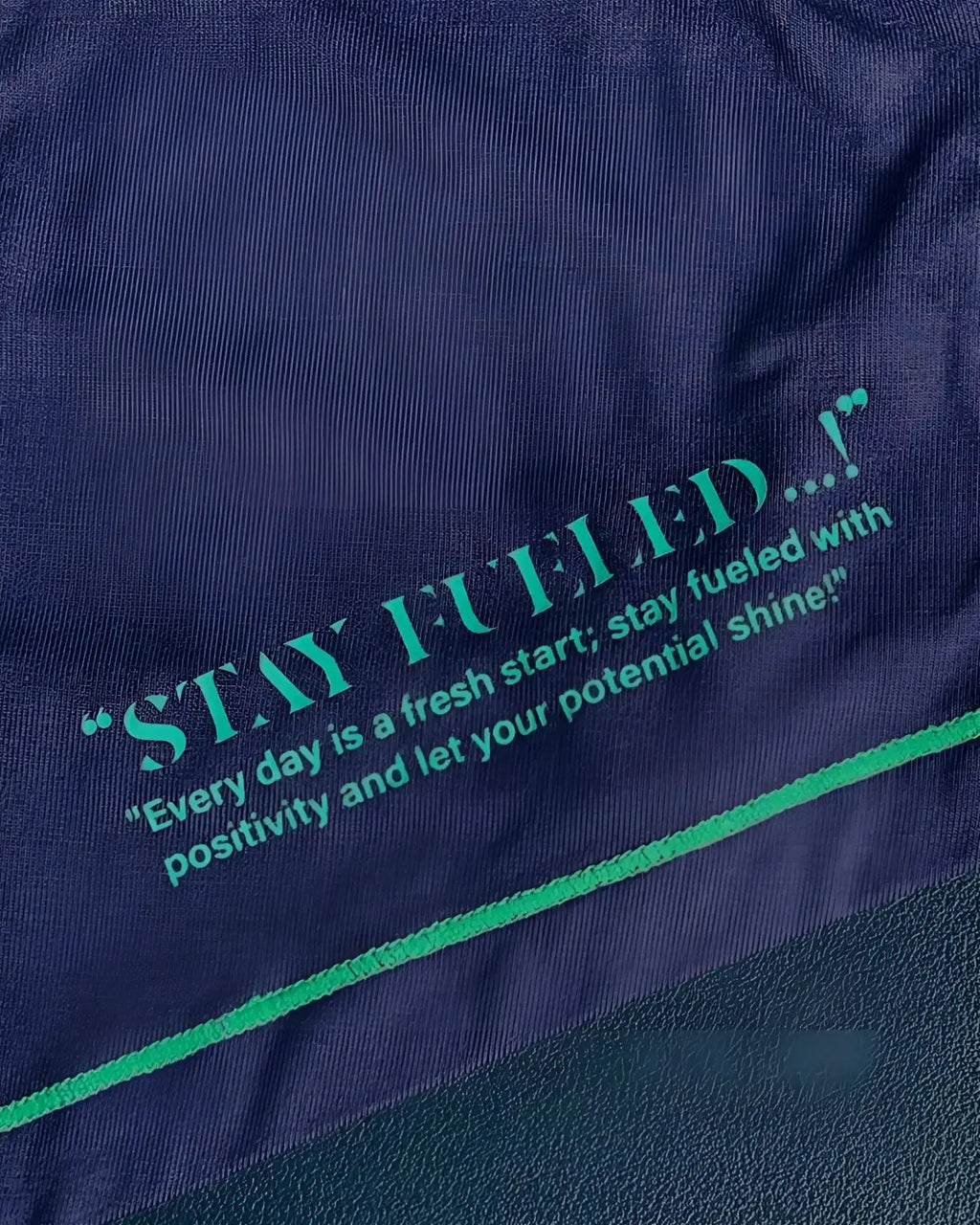 Navy blue cotton t-shirt from Private Structure with teal embroidered text and matching seam detailing