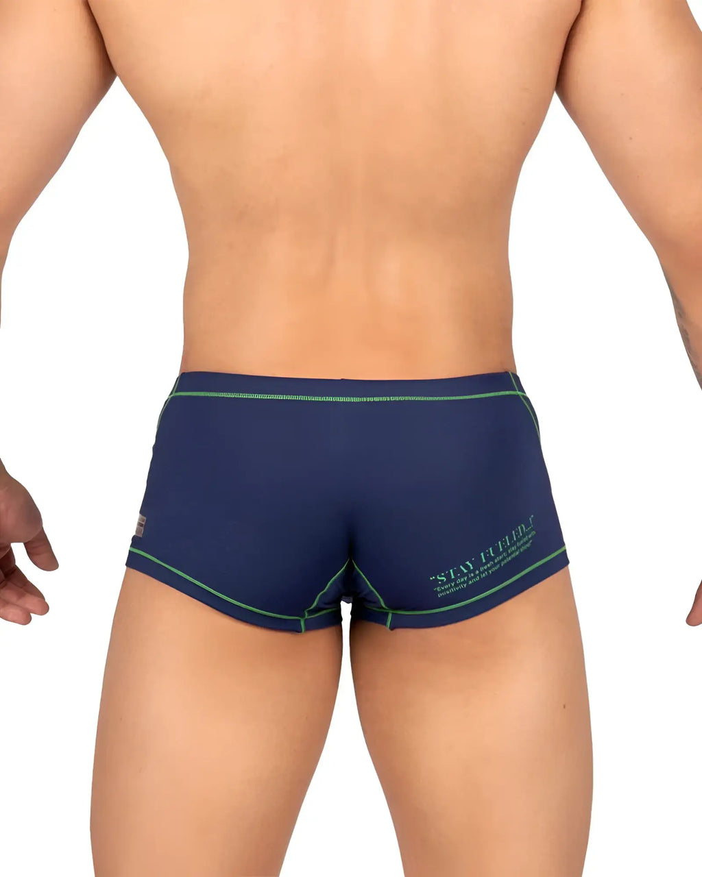 Back view of navy blue private structure epus4570 prime elysian hipster swim trunks with green trim and stay firm logo