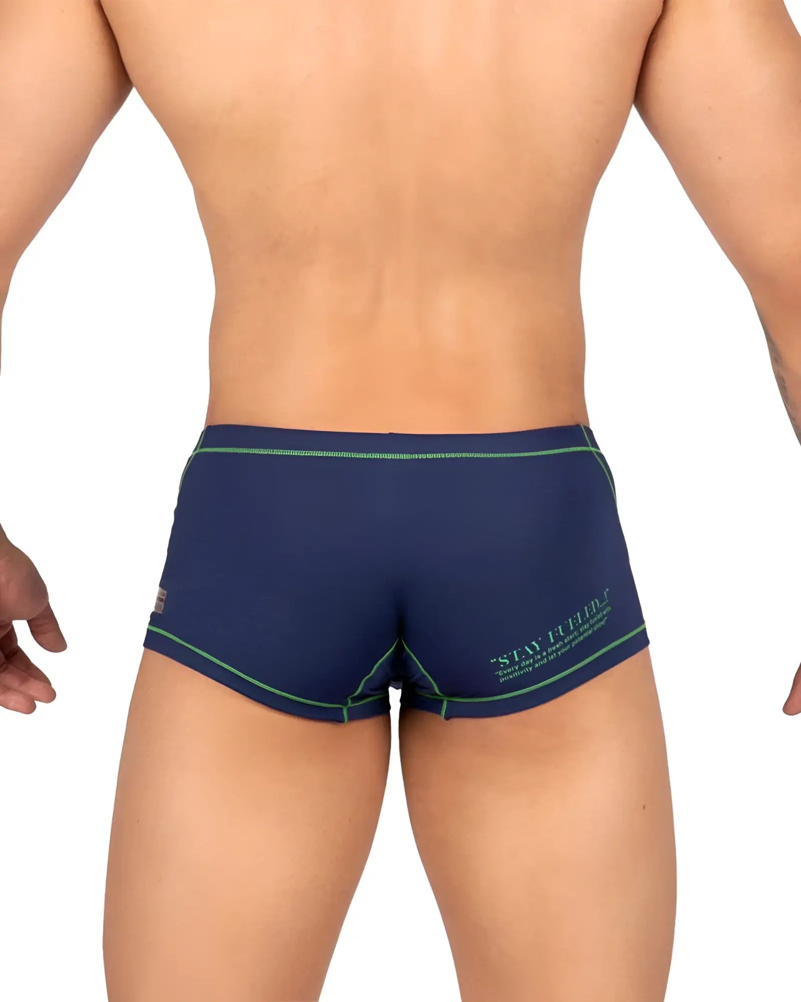 Back view of navy blue private structure epus4570 prime elysian hipster swim trunks with green trim and stay firm logo