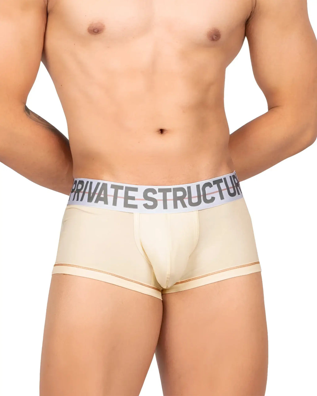 Cream-colored men’s boxer briefs with white elastic waistband featuring private structure logo in bold black lettering