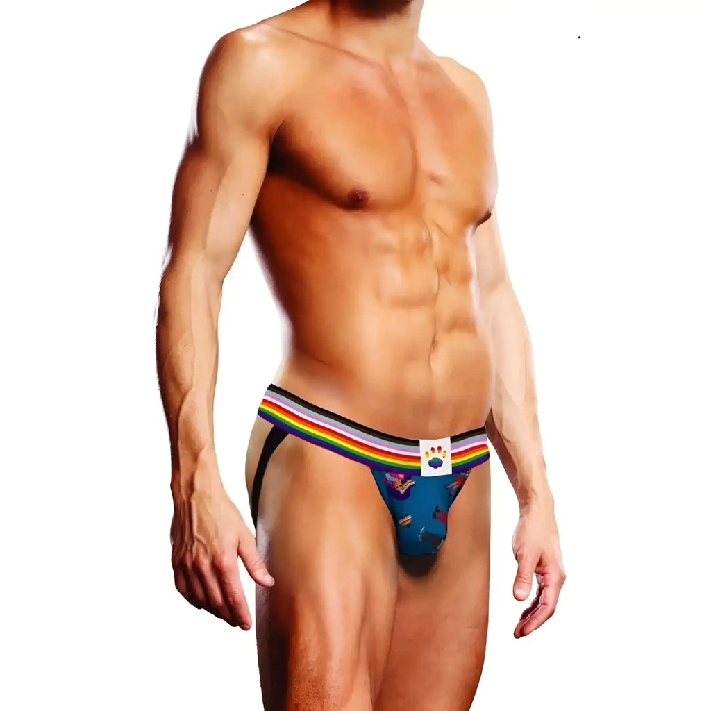 Blue men’s jockstrap with rainbow-striped waistband and white label featuring colourful paw print
