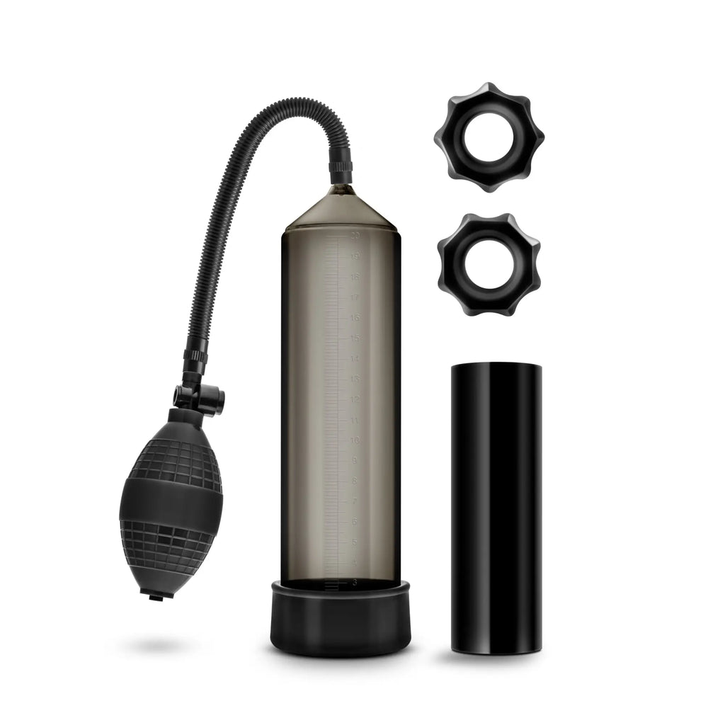 Black and translucent gray vacuum pump with two black star-shaped rings and cylindrical base in Quickie Kit Thick Cock Black