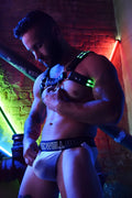 Black and neon green leather rave bulldog harness with metallic hardware designed for edgy festival wear