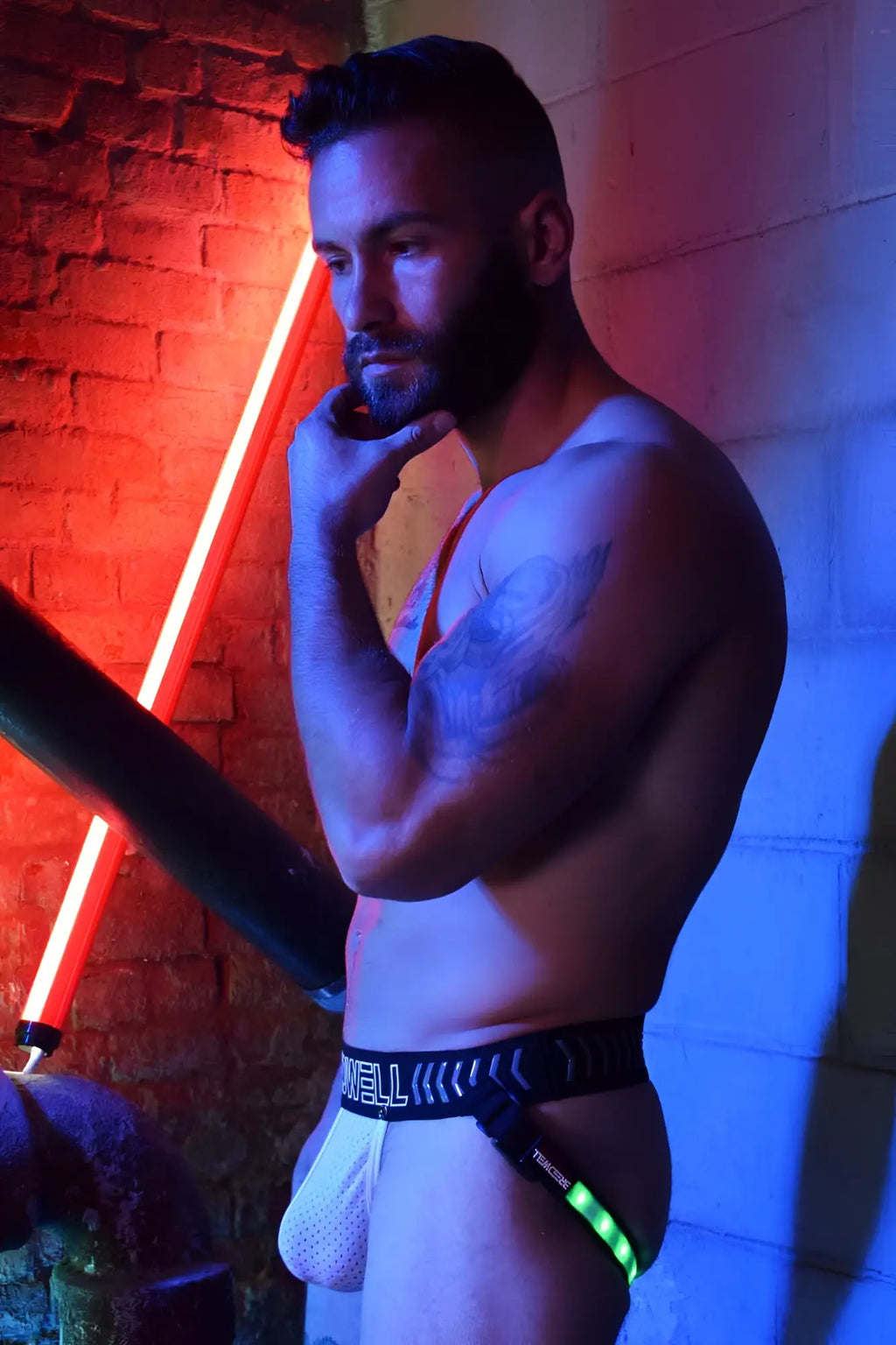 Black and neon green rave legstrap jock system briefs with mesh fabric designed for rave and festival wear
