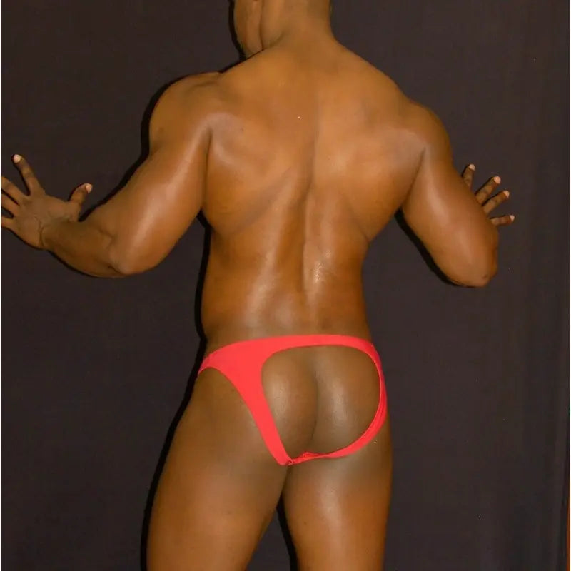 Red bikini jockstrap underwear by Arroyman featuring a minimal back design and elastic waistband shown on a model from the back.