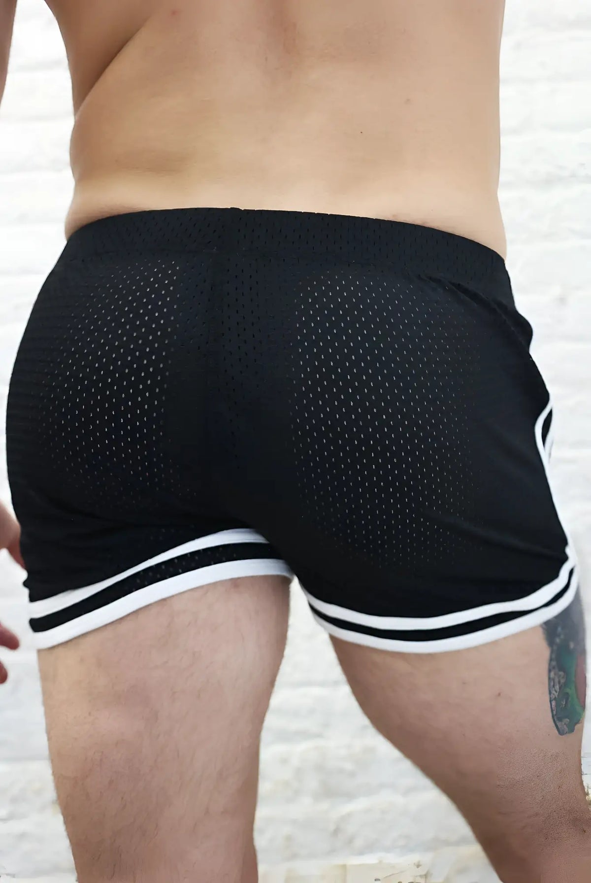 Black mesh athletic shorts remix circuit shorts 2.0 with white striped trim for training and casual wear