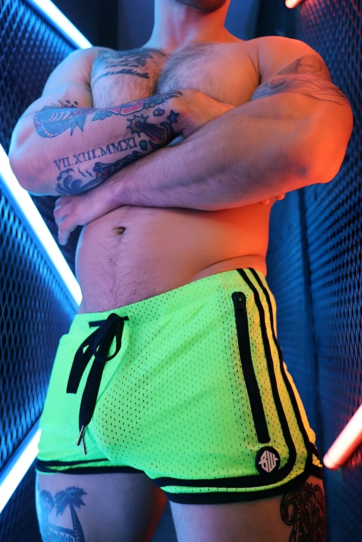 Neon green mesh remix circuit shorts 2.0 with black side stripes and a zipper pocket for athletic use