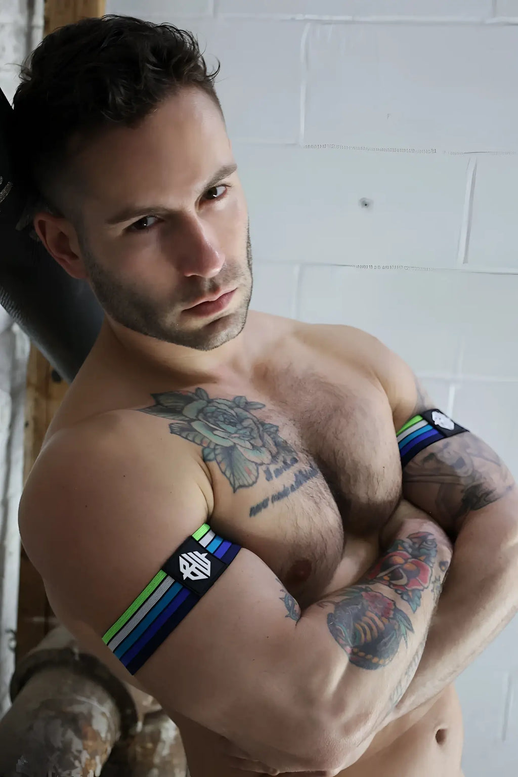 Black and rainbow-striped athletic armband with white logo retro remix armband for sports and fitness use