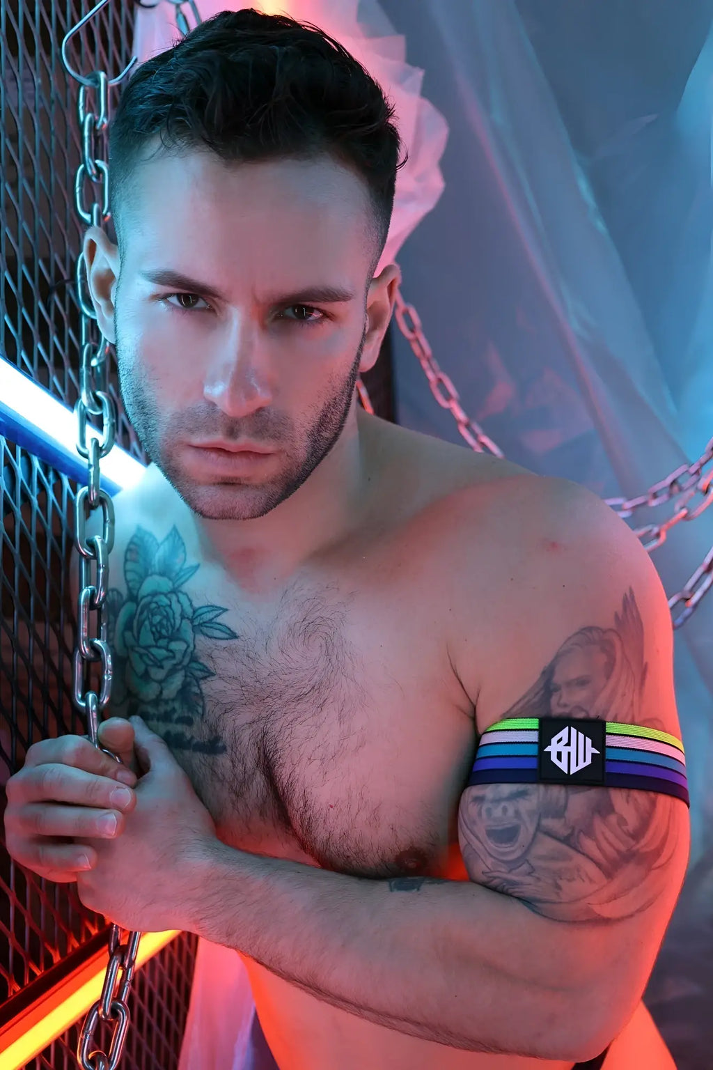 Retro remix armband with rainbow stripes and a black central patch featuring white lettering on fabric material