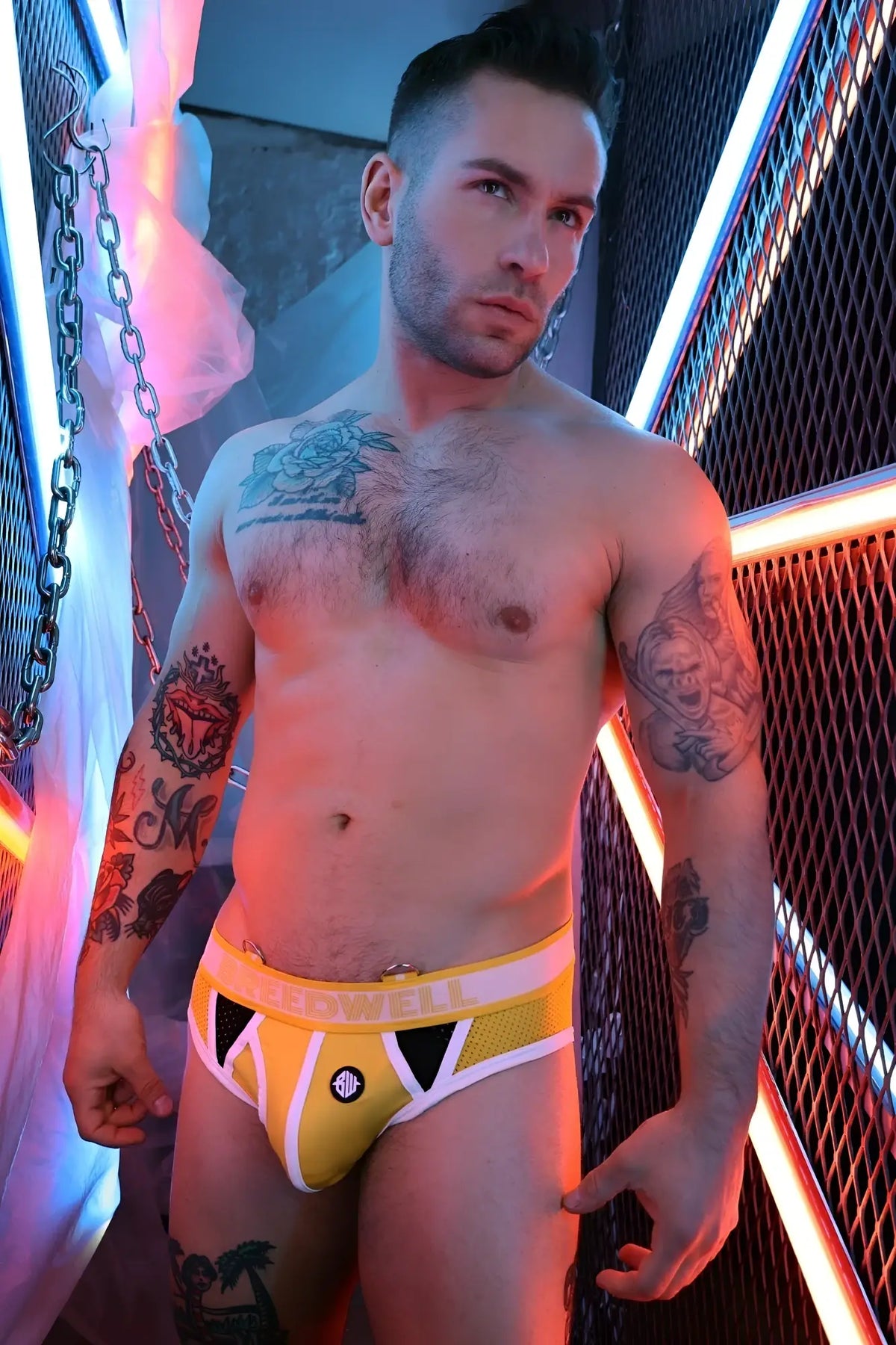 Retro remix briefs in yellow and white athletic-style fabric with black triangular accents and a front circular logo