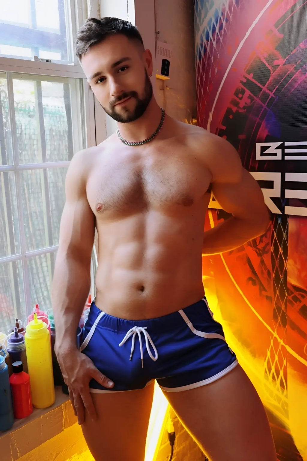 Blue athletic shorts with white trim and drawstring designed for retro style and comfortable activewear use