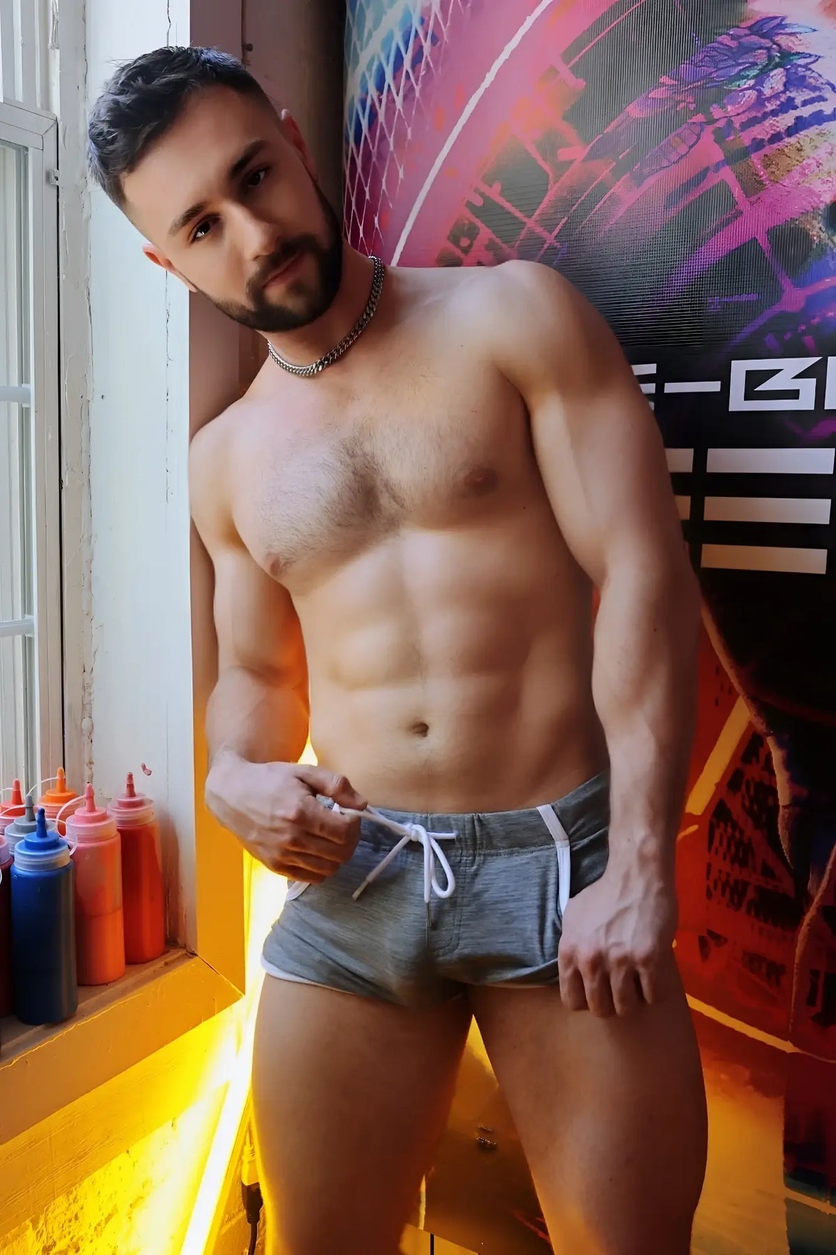 Gray retro remix athletic shorts with white drawstring and side stripes made of breathable fabric