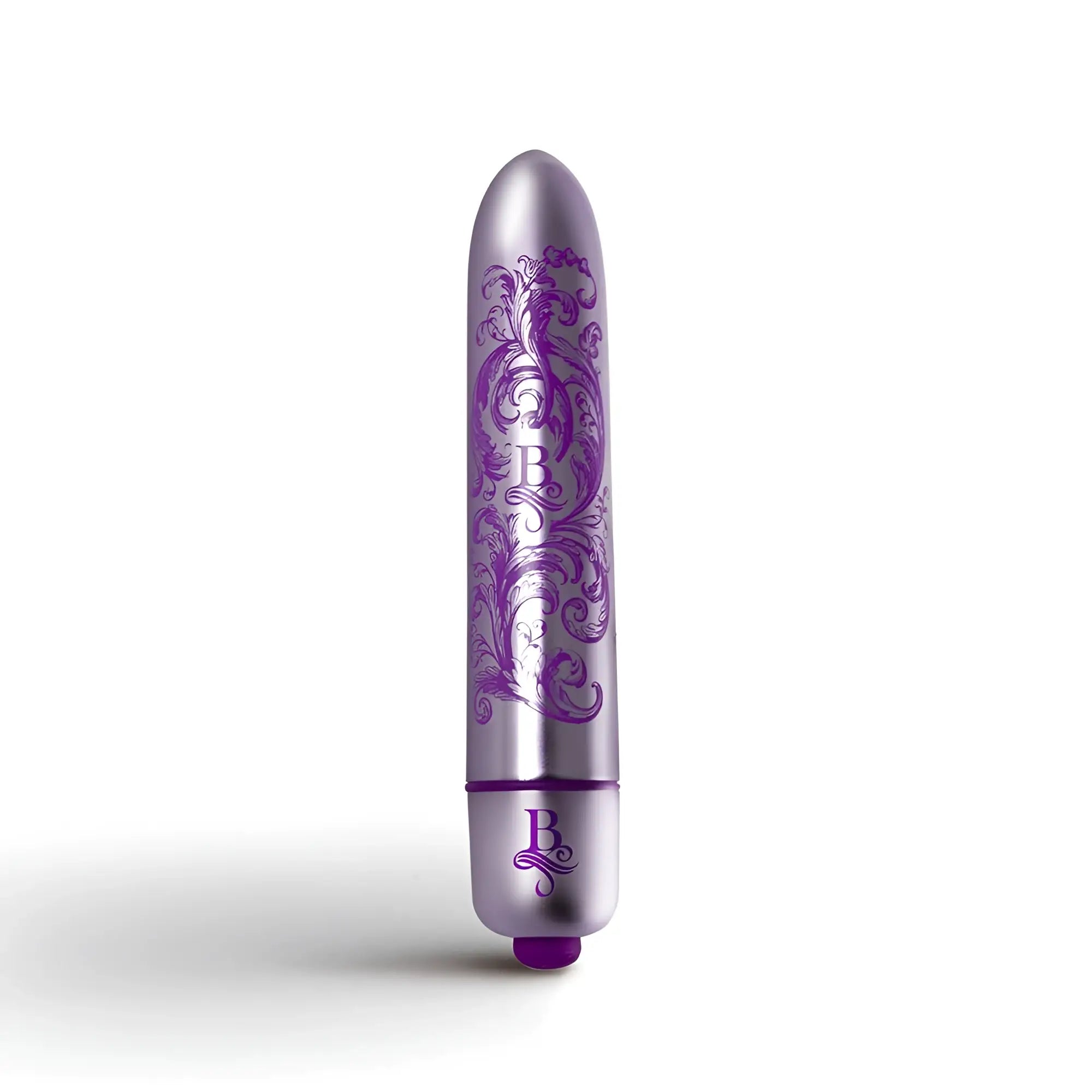 A sleek metallic purple vibrator bullet with ornate floral engravings and matching rocks off boudoir logo