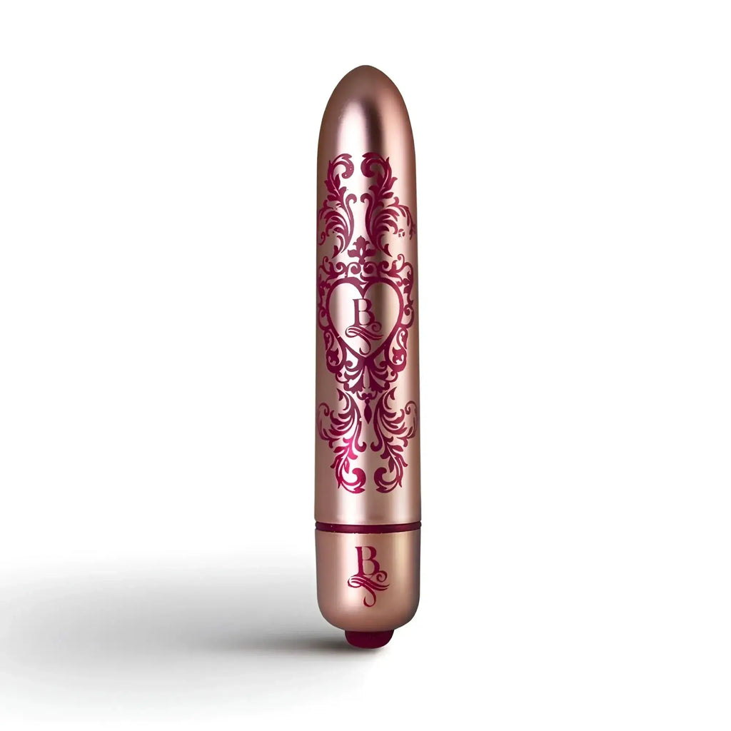 Rose gold cylindrical vibrator rocks off boudoir promenade bullet with intricate burgundy floral and heart design.