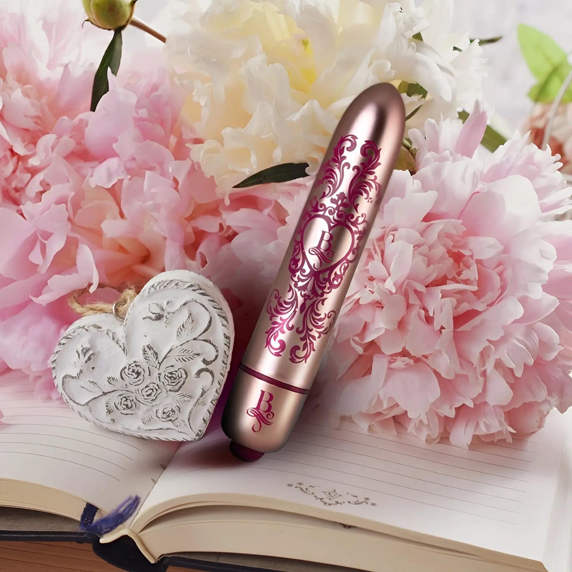 Rose gold rocks off boudoir promenade bullet vibrator with intricate pink floral and heart designs and metallic finish