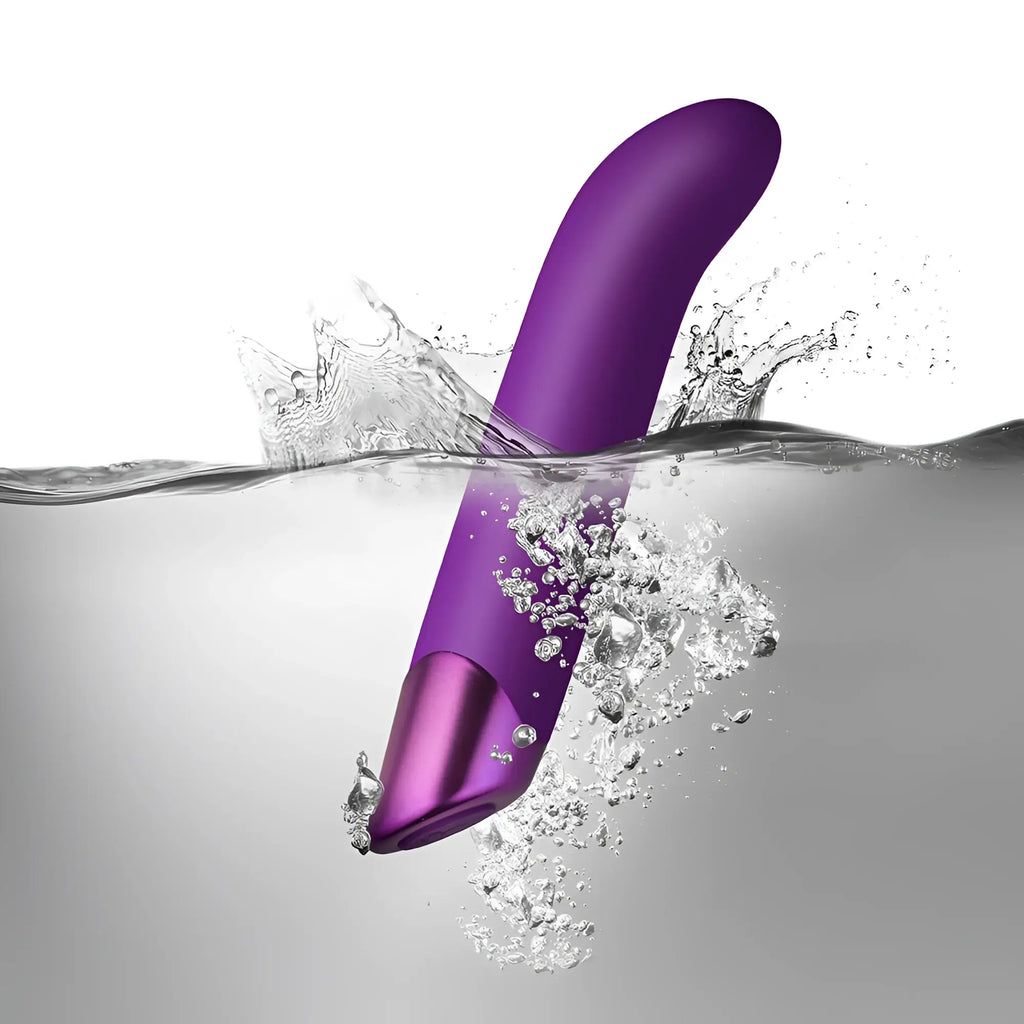 Rocks off chaiamo g purple silicone vibrator with metallic purple tip partially submerged in water
