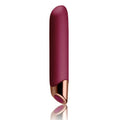 A sleek matte burgundy rechargeable Rocks Off Chaiamo adult toy with a rose gold metallic tip and button