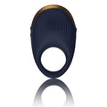 Navy blue silicone vibrating cock ring with gold metallic trim and vertical ridges rocks off climaximum