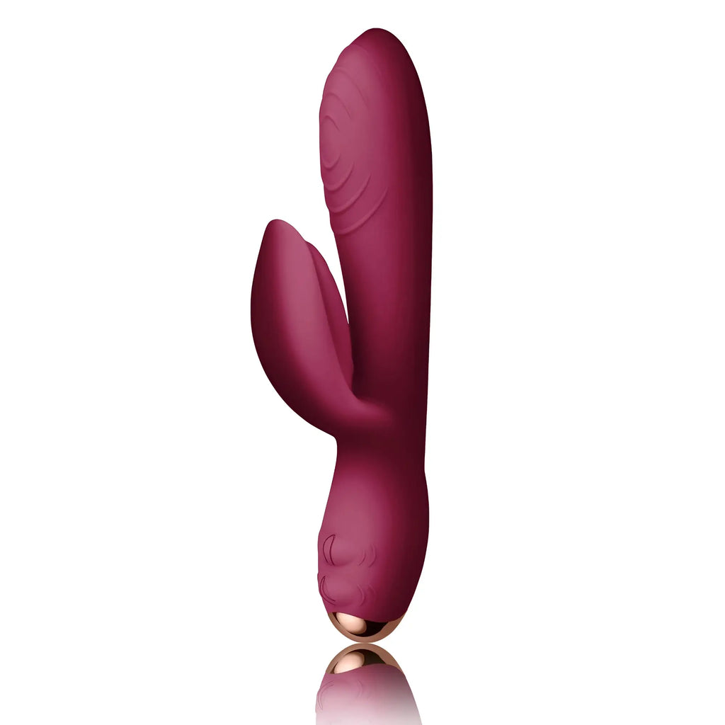 A sleek deep burgundy silicone rocks off every girl rabbit vibrator with rose gold base and textured ridges