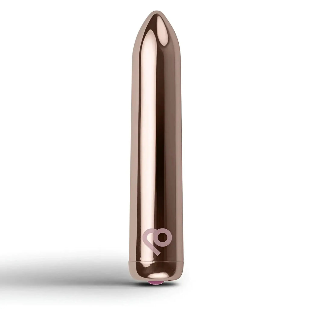 Rose gold metallic rechargeable bullet vibrator with sleek smooth surface and subtle logo near the base by Rocks Off