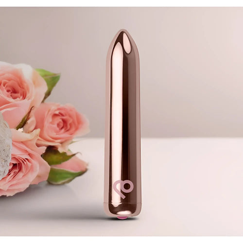 Rose gold metallic cylindrical vibrator with sleek tapered design and subtle logo near base in Rocks Off Golden Rose Rechargeable Bullet