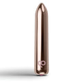 Rose gold metallic rechargeable bullet vibrator with sleek smooth surface and subtle logo near the base by Rocks Off